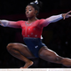 Simone Biles performs on the balance beam during the Women’s Team Finals at the gymnastics world championships Oct. 8, 2019, in Stuttgart, Germany.